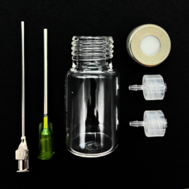 Microfluidic reservoir bundle, consisting of a glass vial, a septum screw cap, two needles and two tubing connectors.